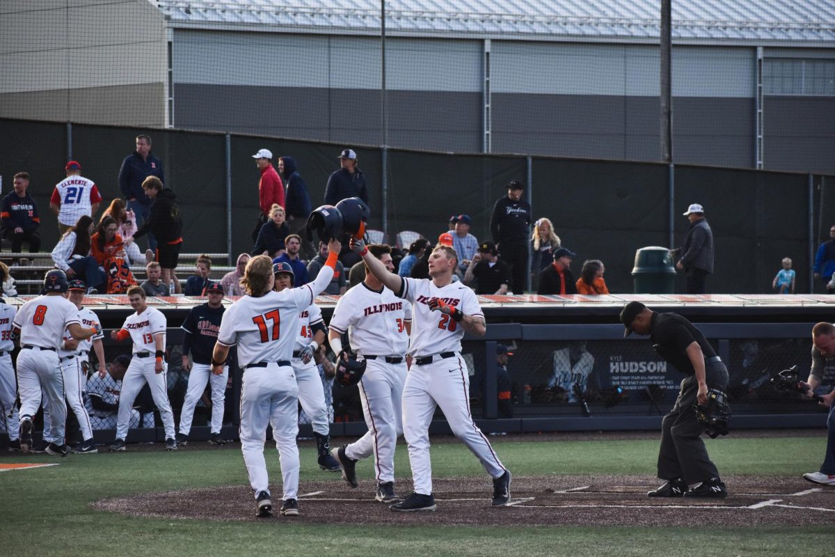 Vytas Valincious celebrates hitting a homerun with the Illini during a baseball game on April 9.