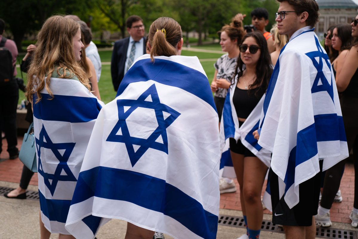 The Jewish community wearing Israel flags during the gathering where Illinois state representatives gave speeches. 