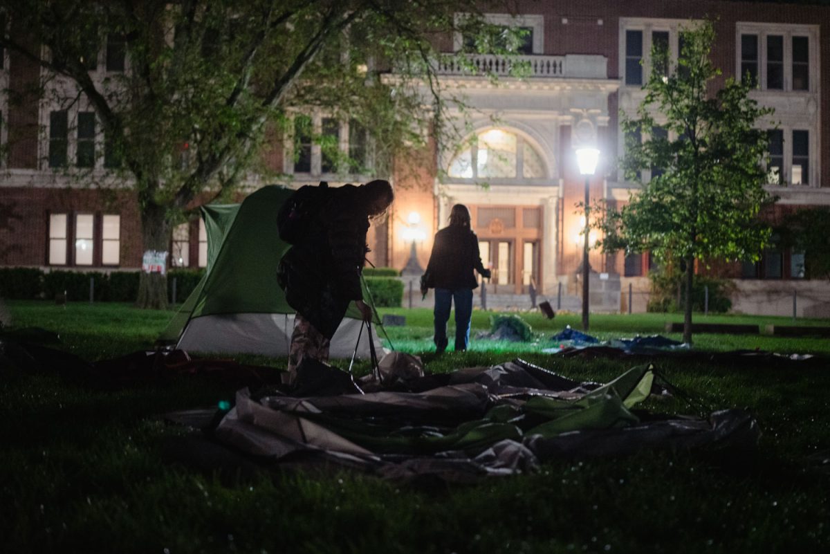 Protesters disassemble their tents on the Main Quad early Friday morning.