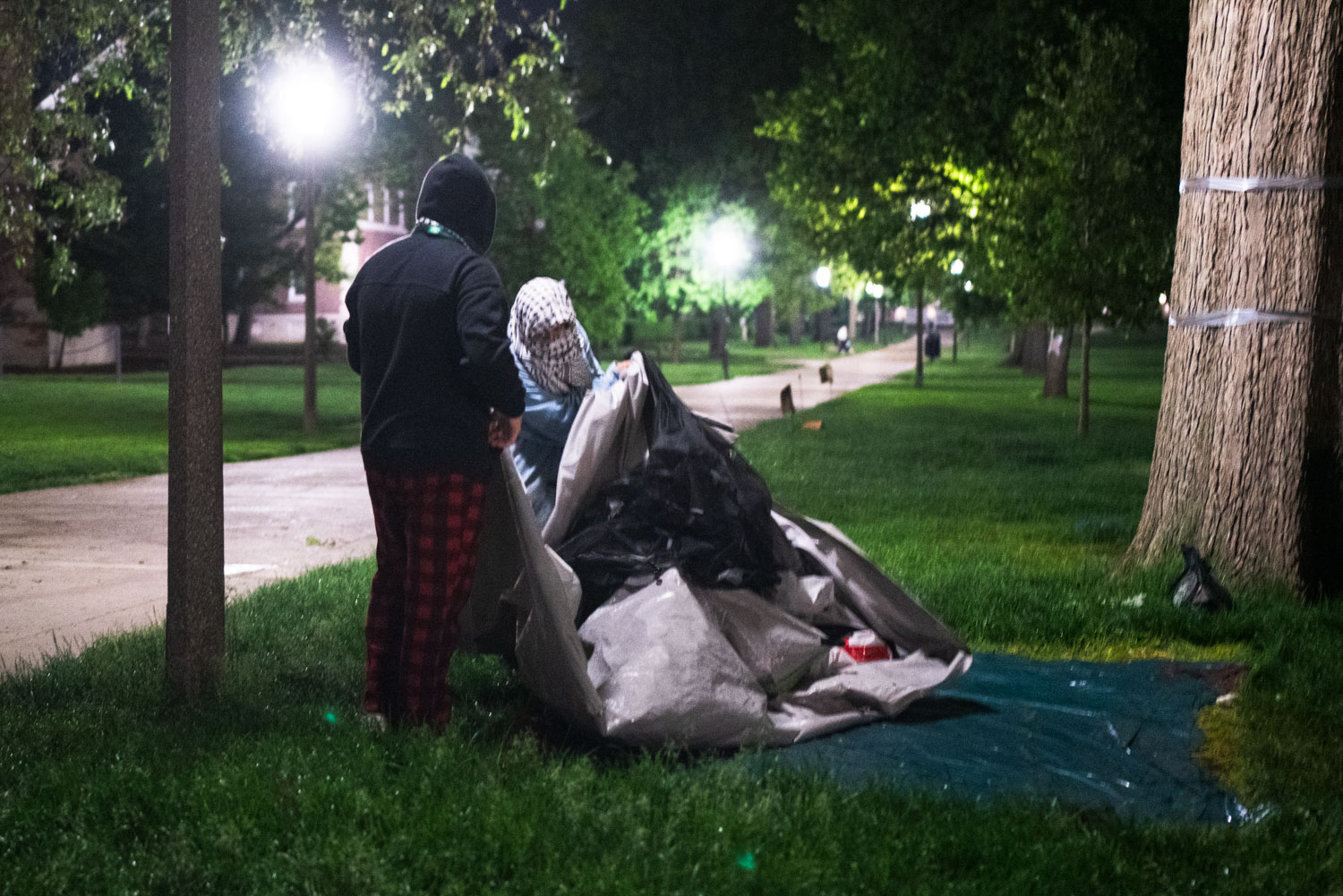 Protesters dismantle and tidy the encampment, including the medical tent, on Friday.