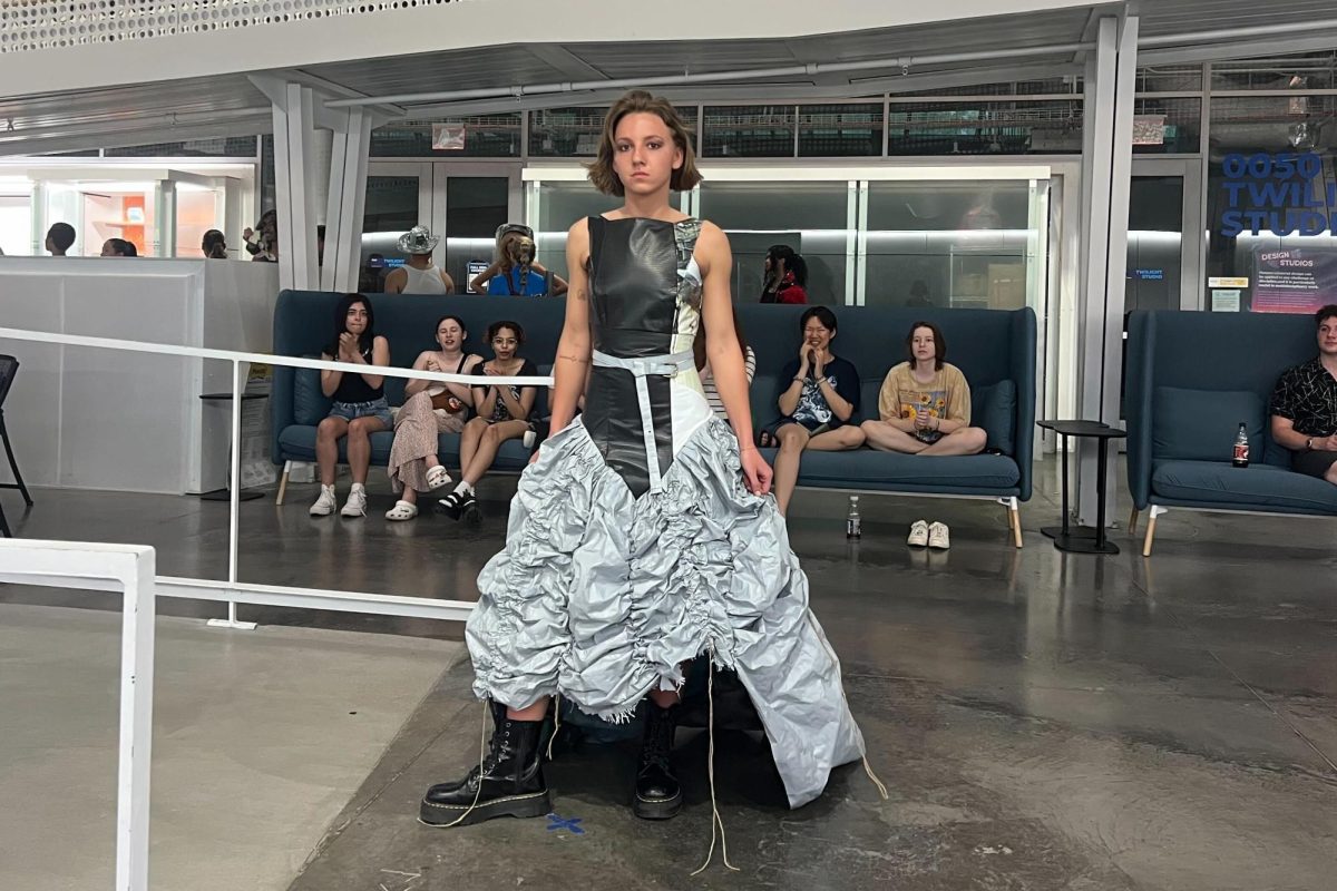 A model poses during the Re-Fashioned Fashion Show in the Siebel Center for Design on Saturday.