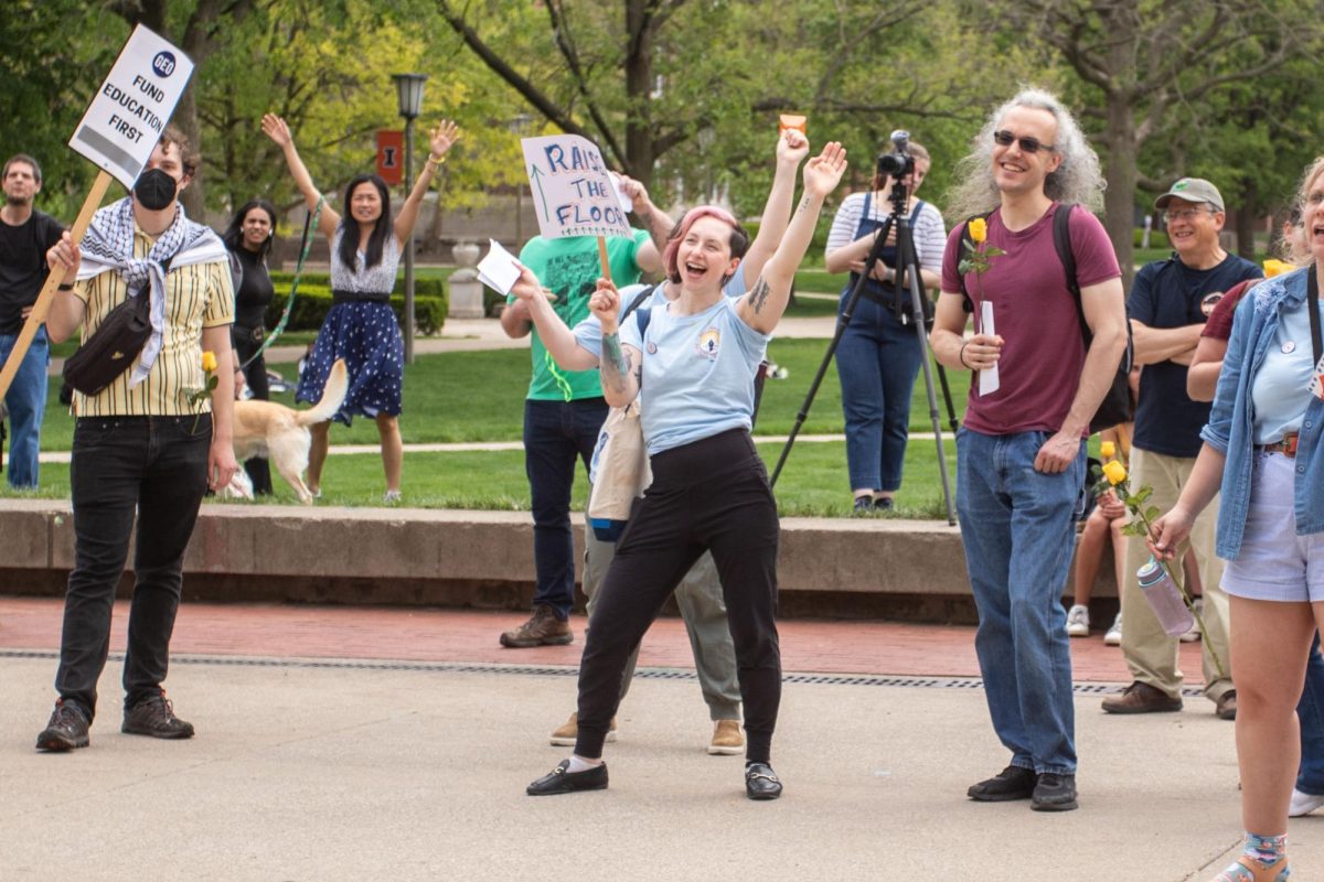 Rachel Fein-Smolinski Professor of College of Fine and Applied Arts chants alongside other protesters at the Main Quad on Thursday.