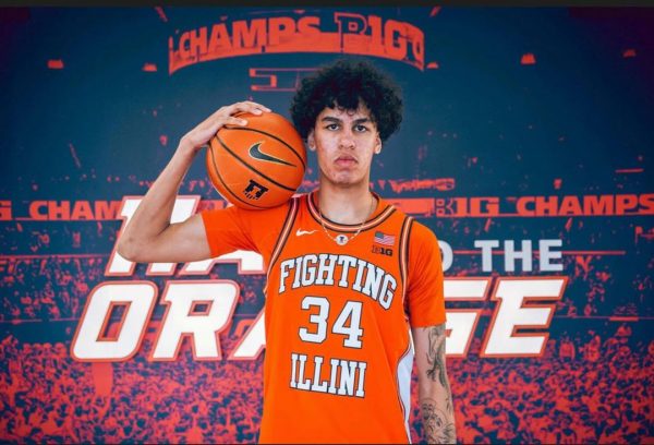 Five-star prospect Will Riley poses with a basketball during an official visit to Illinois.