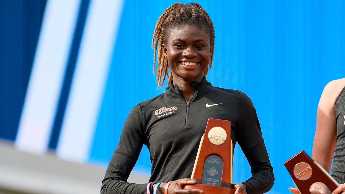 Rose+Yeboah+holds+her+first+place+high+jump+trophy+at+the+2024+NCAA+Outdoor+Track+%26+Field+Tournament.+Three+Illini+won+national+titles+at+the+tournament.