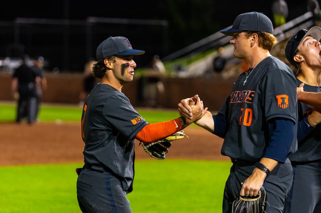 Illinois baseball players shake hands after a game on May 17. The Illini won their first NCAA Tournament matchup against Indiana State, lost their second game against Kentucky, and will again face Indiana State this afternoon for a chance to play Kentucky in the NCAA Regional Championship.