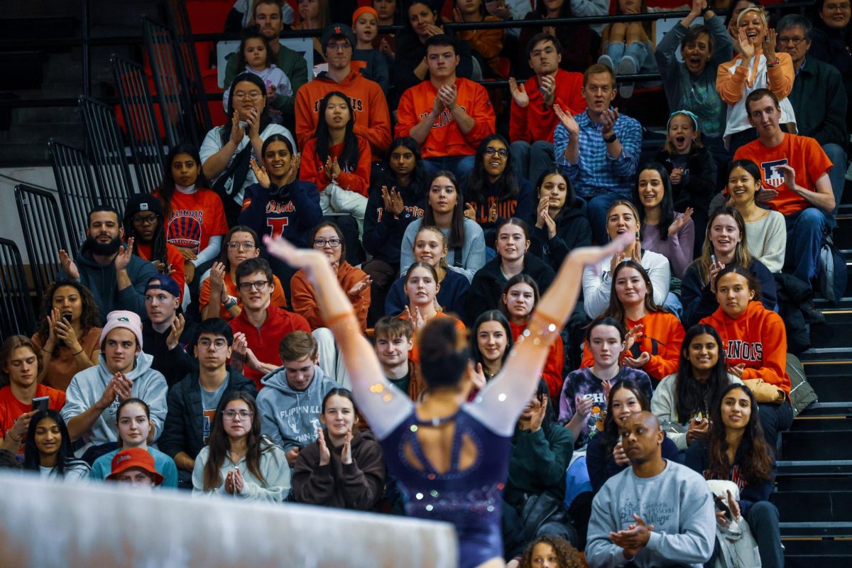 On Feb. 18, Illini fans cheer during a women's gymnastics match at Huff Hall.