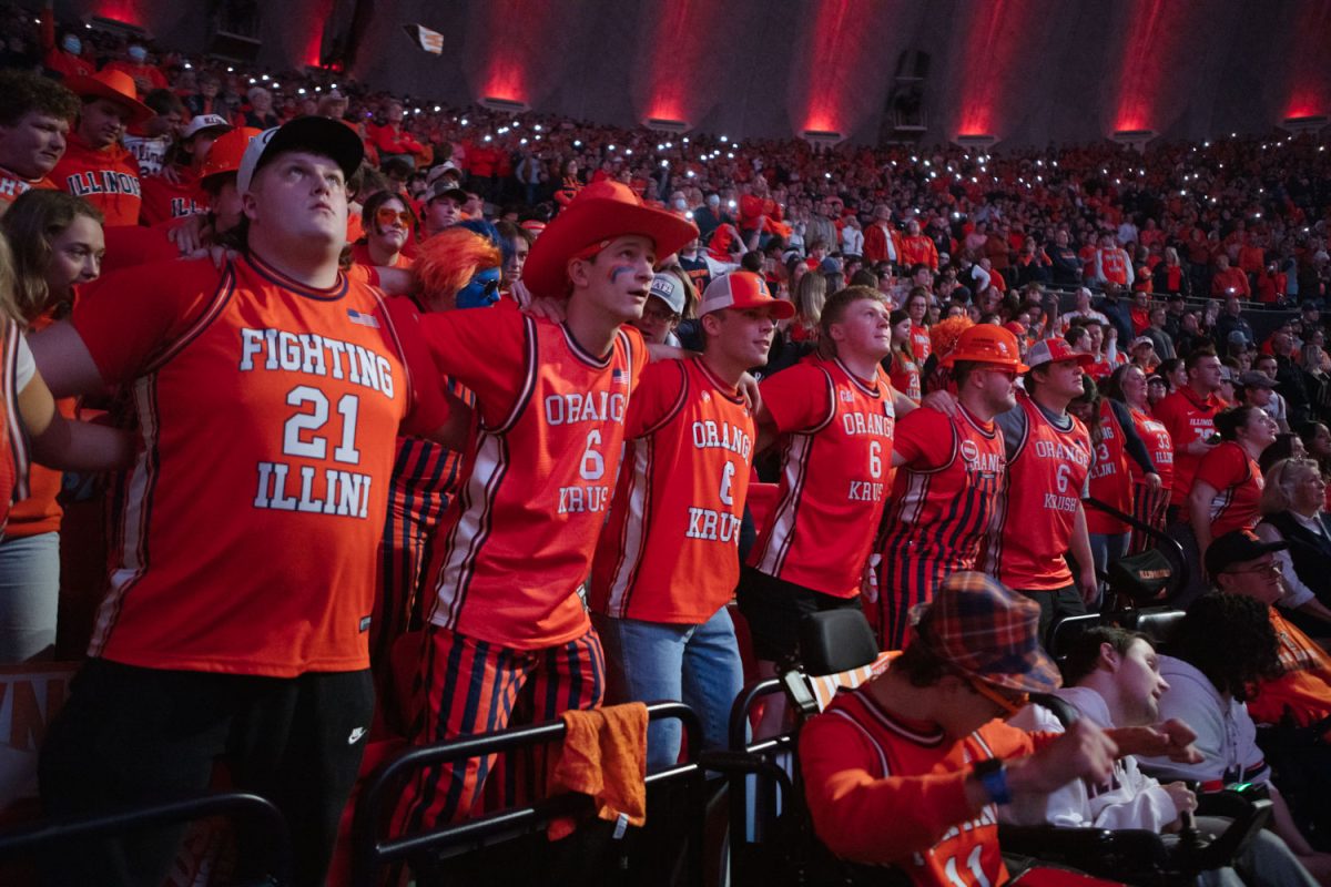 Orange Krush gather together as the starting lineup is introduced during a senior night men's basketball game at the State Farm Center on March 5.