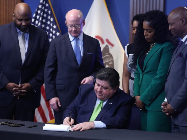 Illinois Gov. J.B. Pritzker signs the 2025 budget on June 5, 2024, in Chicago.