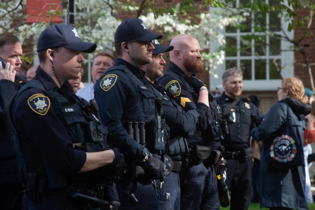 University of Illinois Police officers stand by the Illini Union during the Alma Mater encampment on April 26.