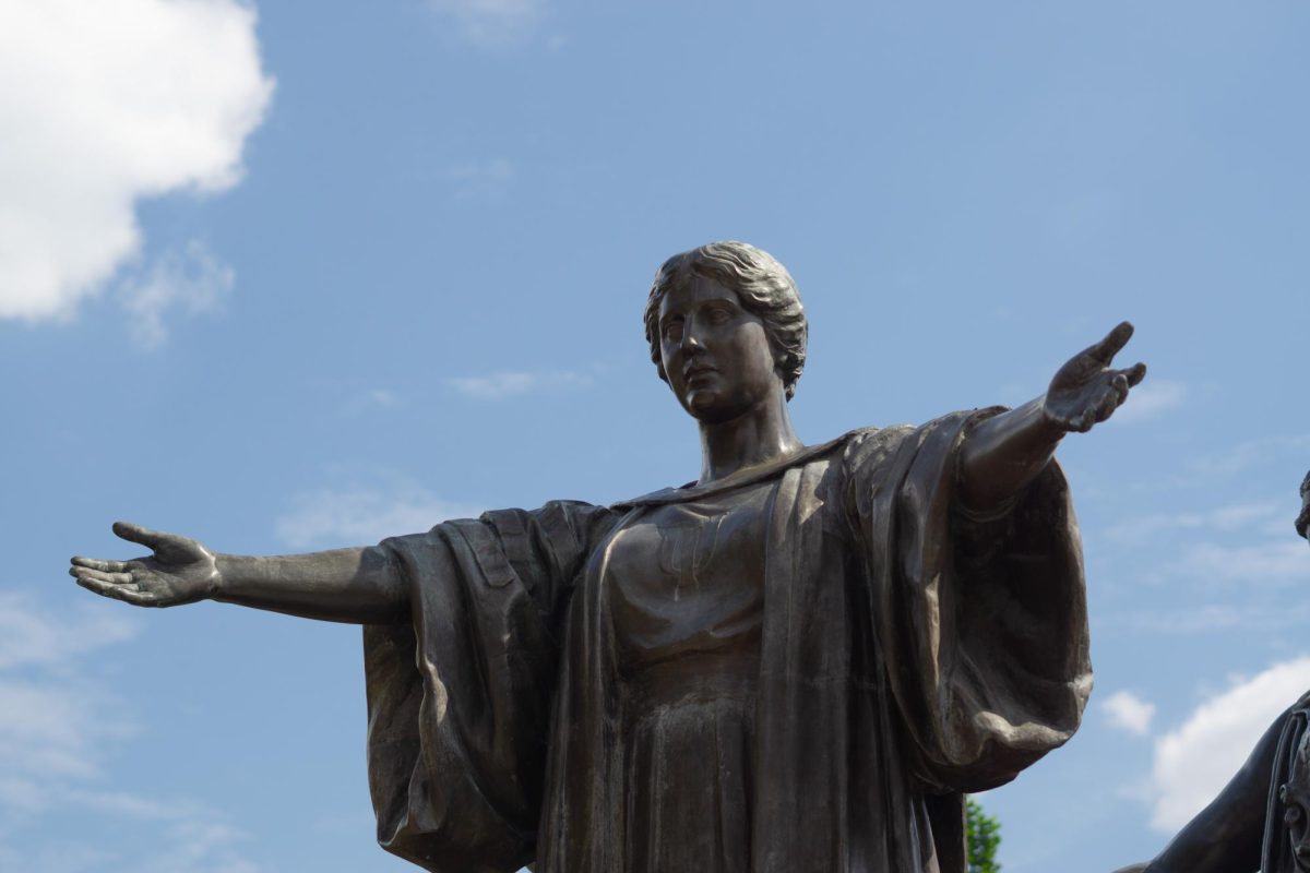 The University's Alma Mater statue, located on the southeast corner of Green and Neil streets.