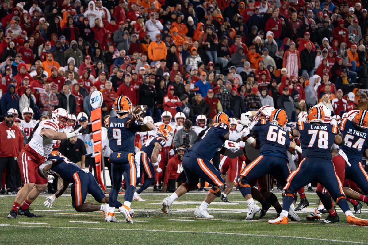 Junior quarterback Luke Altmyer passing the ball during a football game against Nebraska on Oct. 6, 2023.