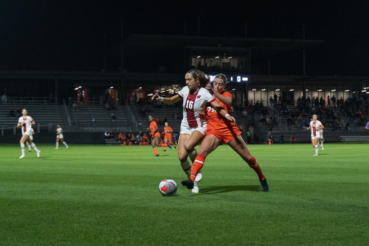 Illini Junior Sydney Stevens battles against Wisconsin senior Gabby Green for possession of the ball in the first half of a soccer match on Oct. 12, 2023.