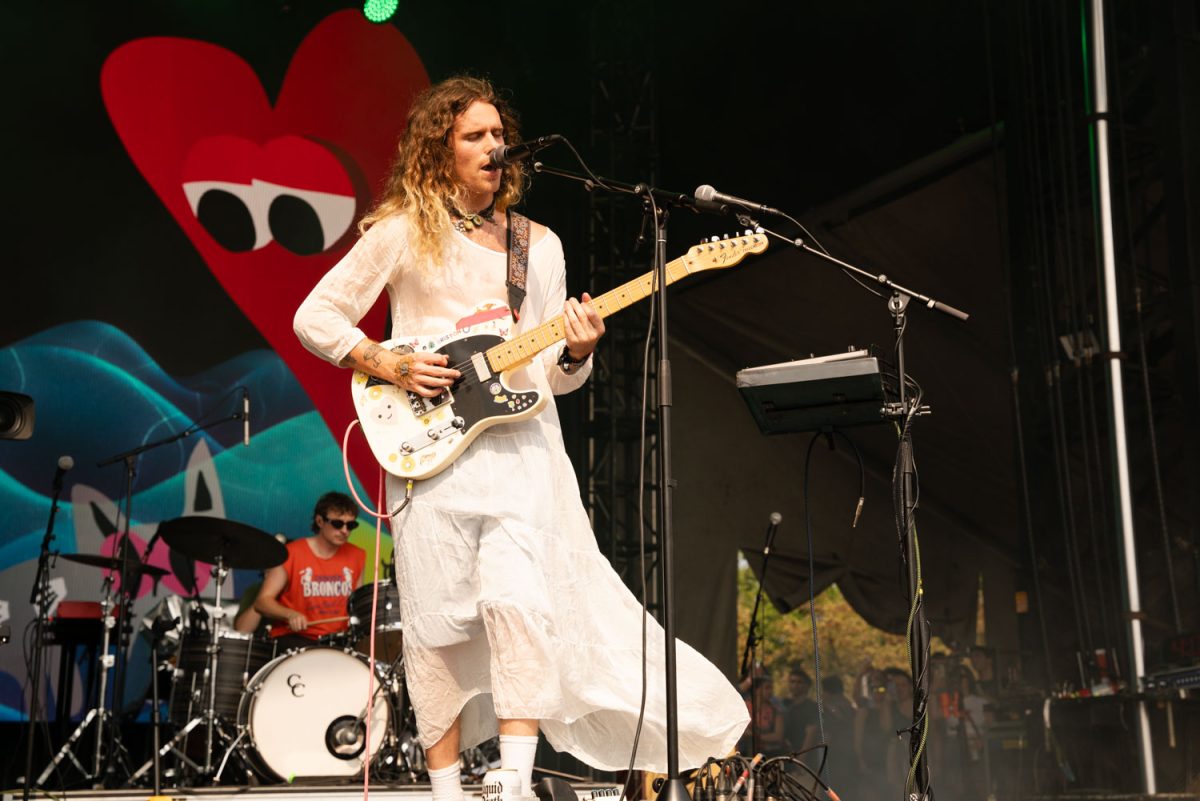 Briston Maroney plays their guitar as their outfit flows in the wind during their set at IHG during day 3 of Lollapalooza.