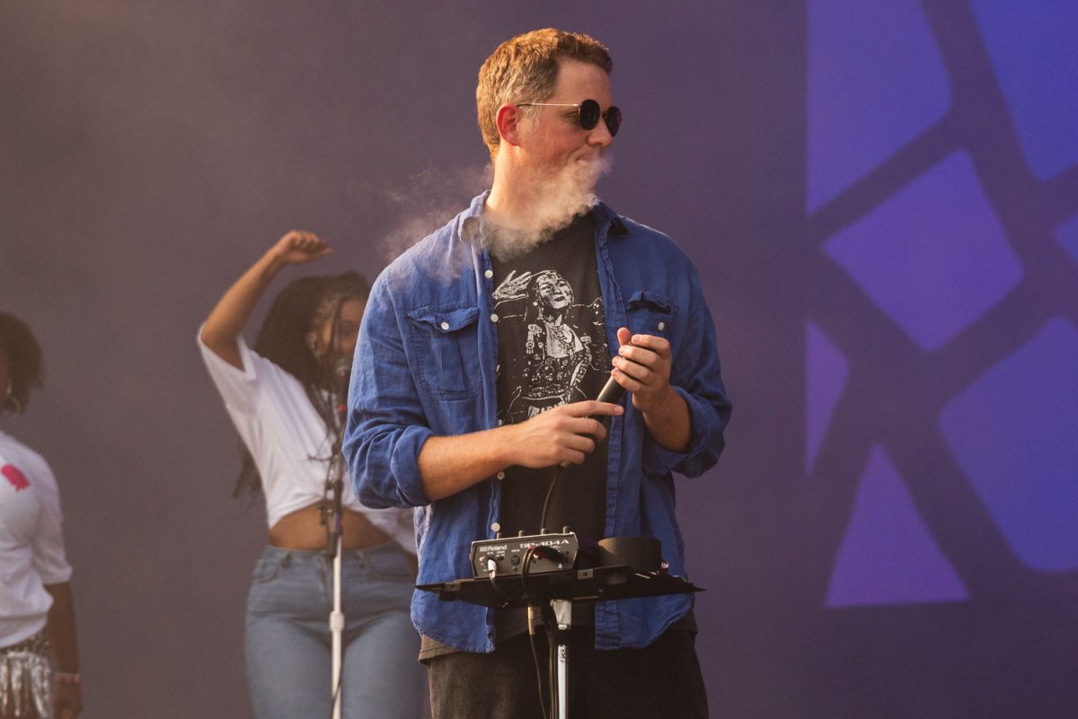 TV Girl lead, Brad Petering hits his vape during the opening of his set at the Bud Light Stage in Grant Park on day 3 of Lollapalooza.