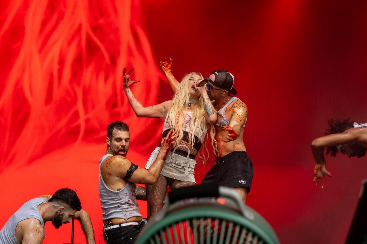 Kesha smears fake blood on her clothes while performing “Cannibal” at Lollapalooza on Aug. 1.