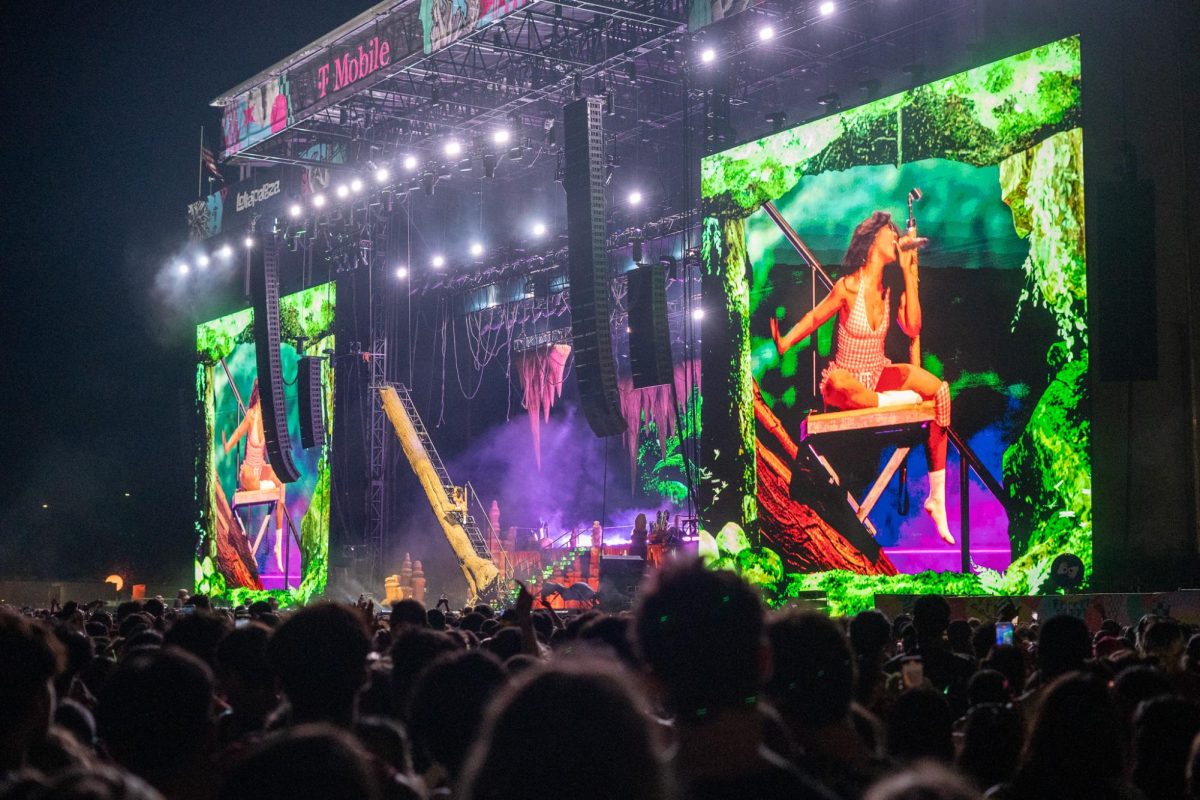 SZA performs on a large tree trunk staircase, fitting with the woodland theme of the set, to finish her show at Lollapalooza on Aug. 2.