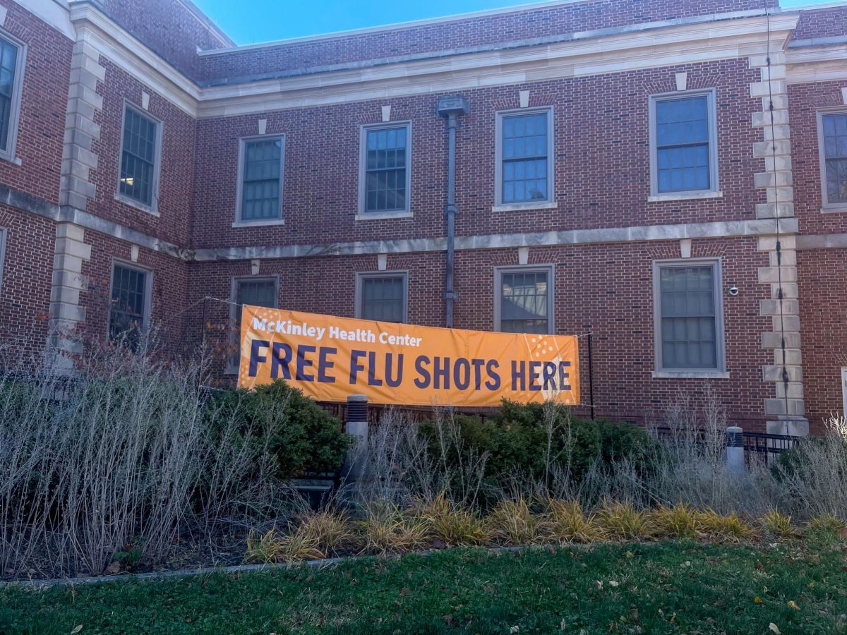 A banner sits outside McKinley Health Center on Lincoln Ave. in Urbana advertising "Free flu shots" to students.