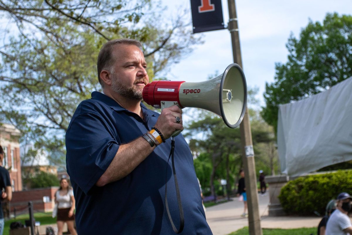 Associate Vice Chancellor James R. Hintz talks to pro-Palestine encampment members on the Main Quad on April 28. Hintz negotiated with protesters throughout the 13-day-long protest in attempts to form an agreement between the University and the encampment.