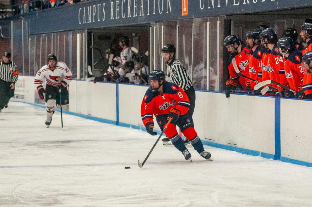 Sophomore forward Aidan Taylor brings the puck across the blue line during a game against ISU on Feb. 23.