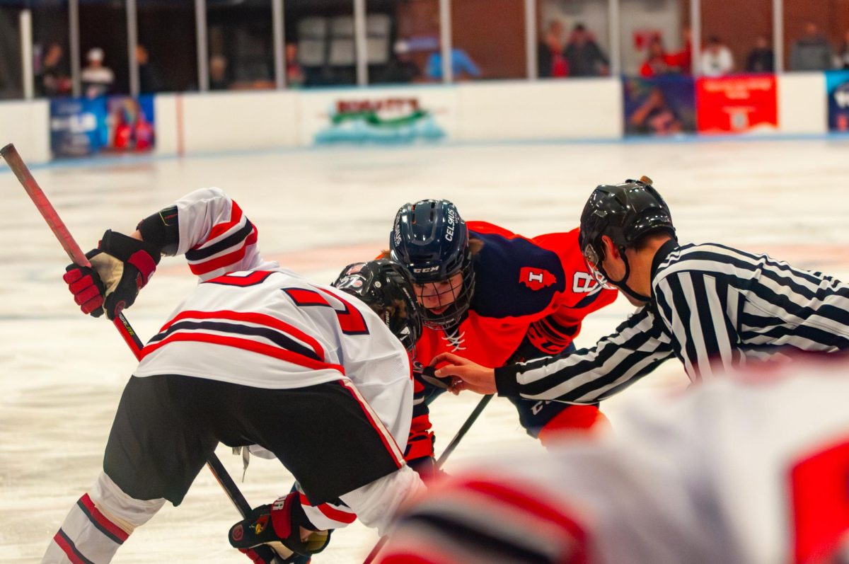 Sophomore Foreward Aiden Taylor lines up for a faceoff against ISU in a game on Feb. 23.