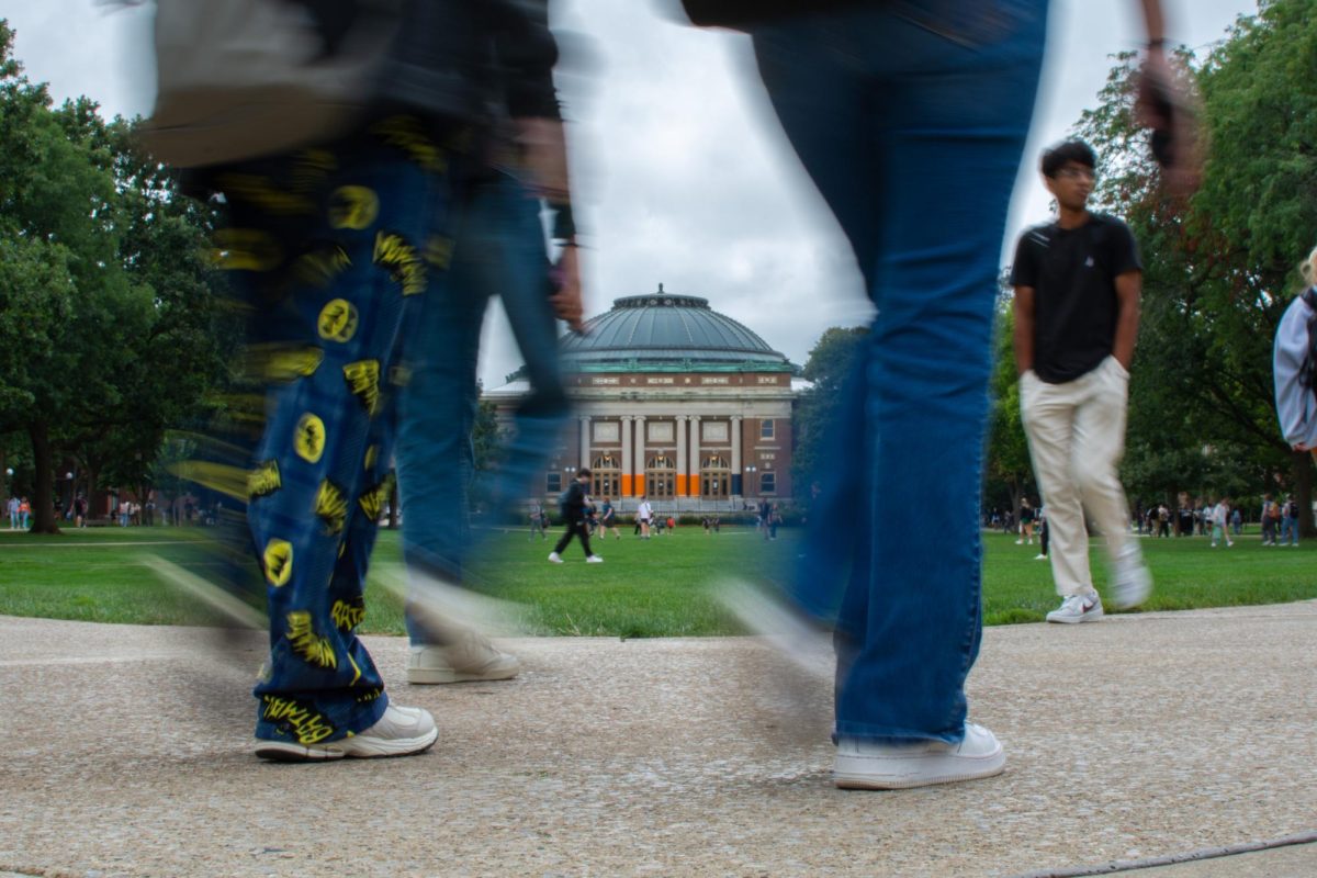 Students walk on the Main Quad between classes.