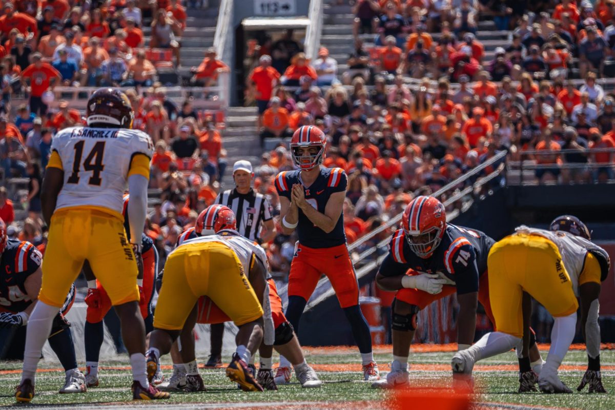 Junior quarterback Luke Altmyer gets ready to snap the ball during the 2024 Homecoming game against Central Michigan on Sept. 14. The Illini would go on to win 30-9.