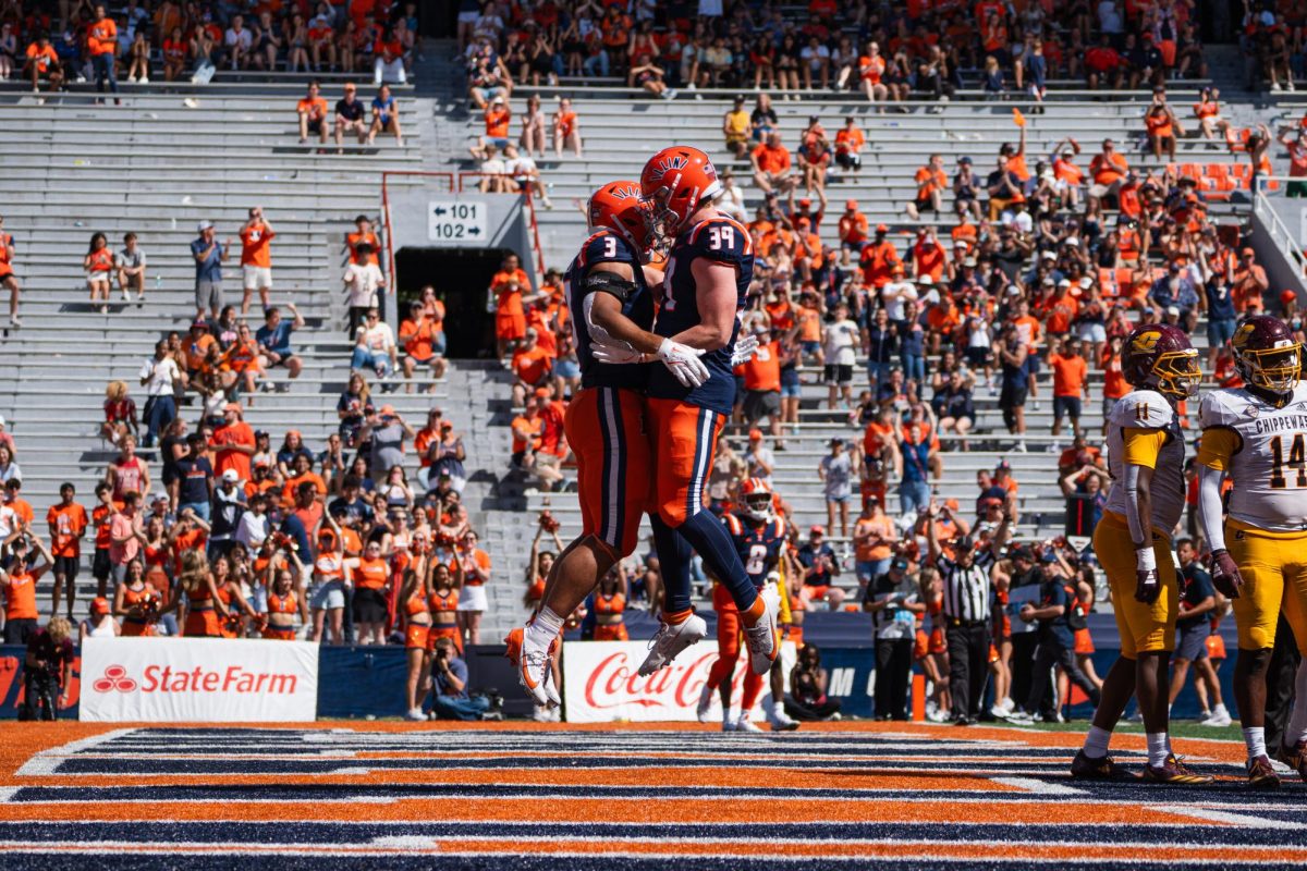 Sophomore RB Kaden Feagin and Freshman TE Jake Furtney celebrate an Illinois touchdown against Central Michigan during Homecoming on Sept. 14.