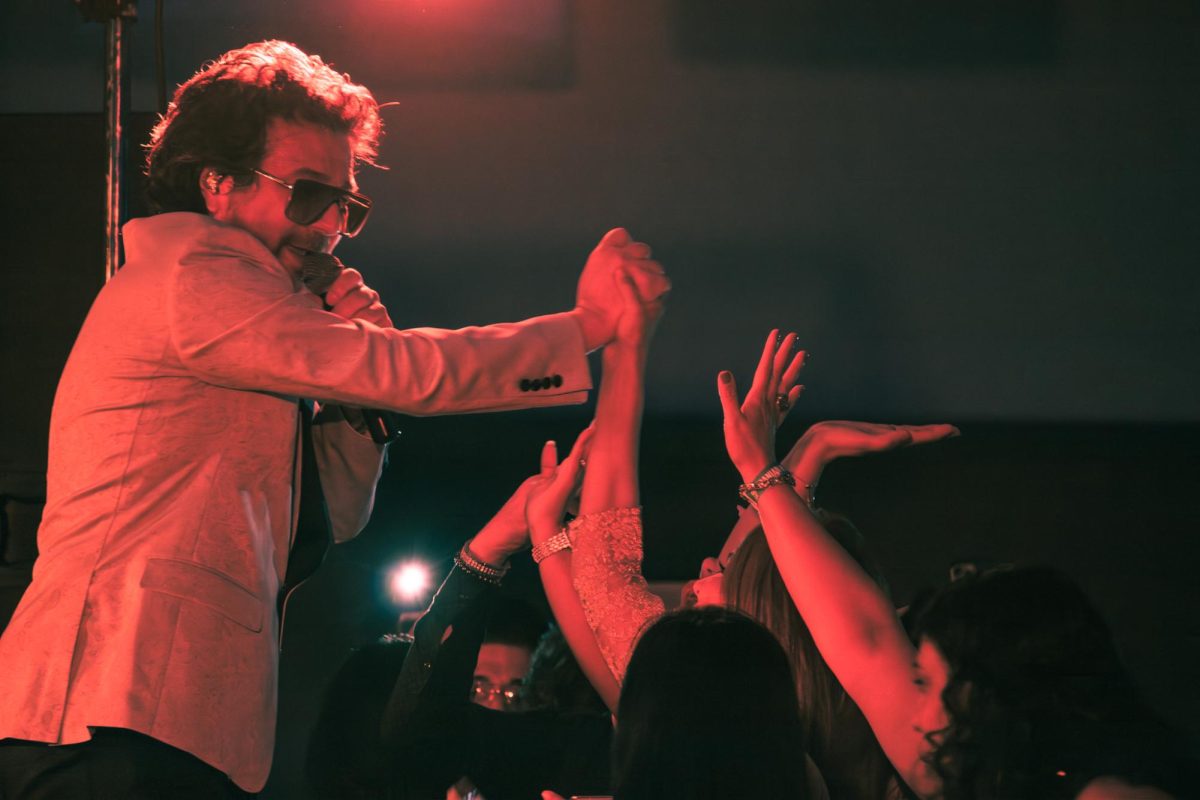 Iranian Singer Mansour engaging with some of his fans while singing and dancing at the Mansour Live show at the I-Hotel on Saturday. 