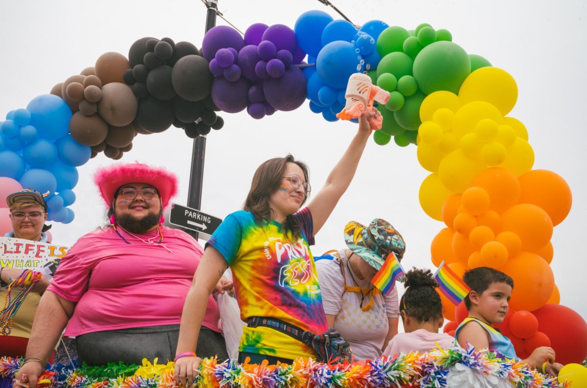 Despite the heat, Pride Fest-goers enjoy the festivities and join the annual parade.