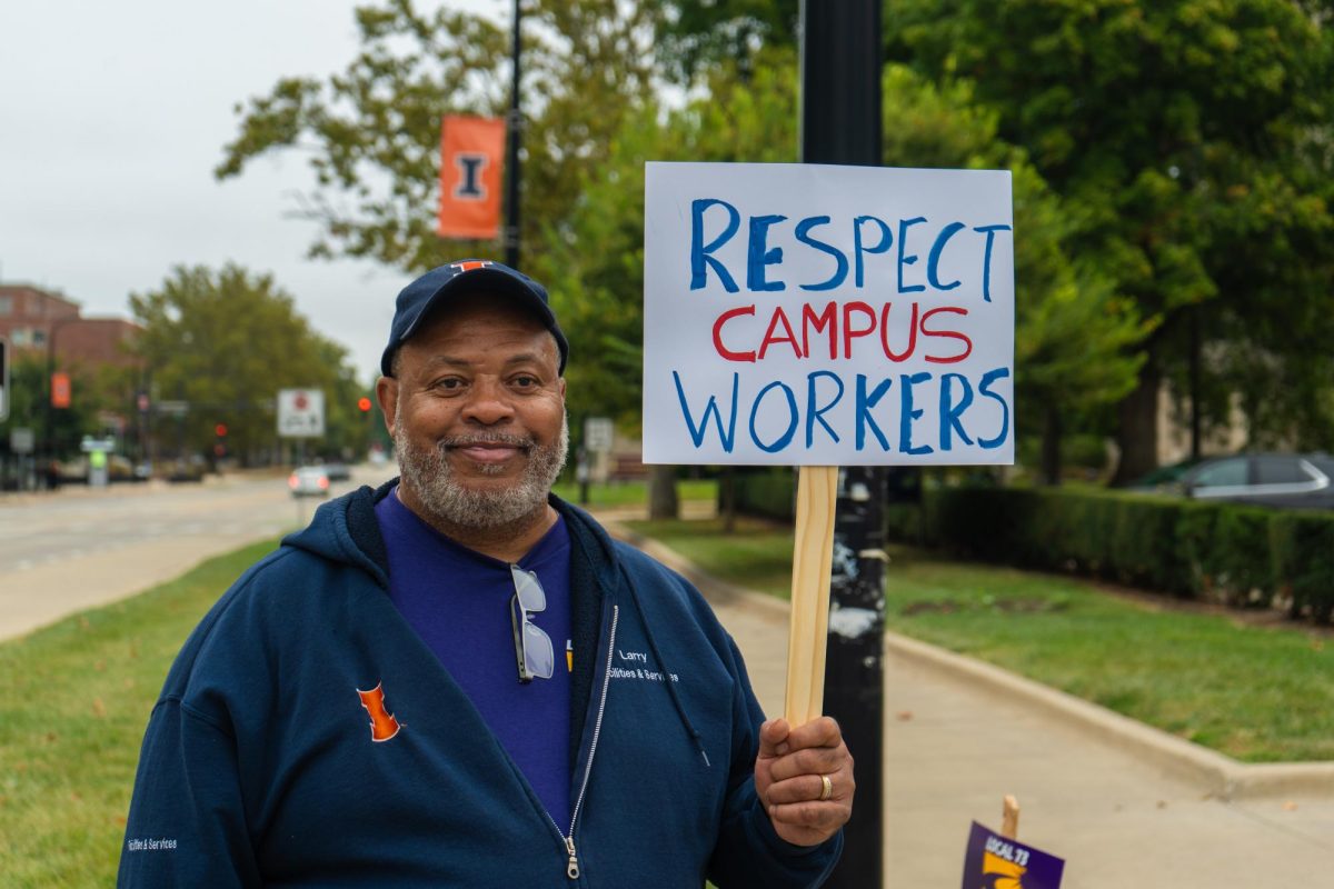 University SEIU workers sing chants and march in circles on strike. The strike began Sept. 23 to demand better wages and other changes.