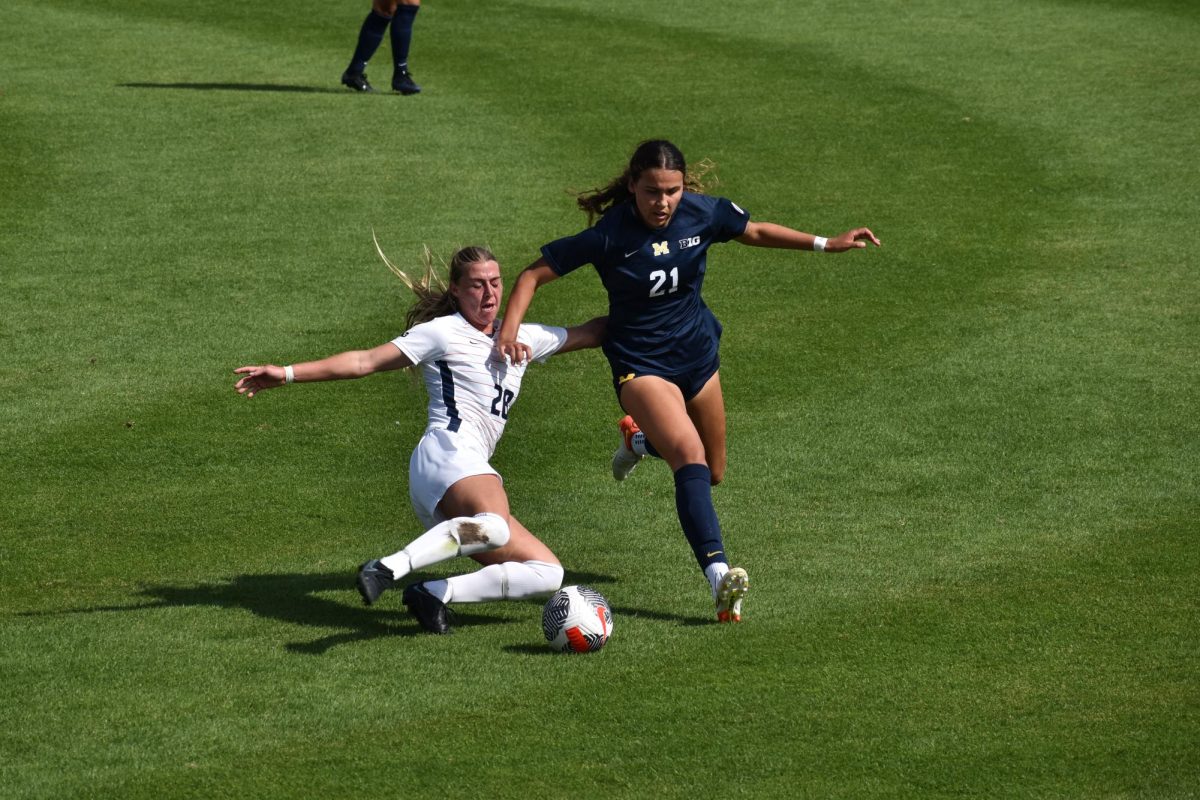 Fifth-year midfielder Sydney Stephens attempting to stop the ball in a match against Michigan on Sept. 24, 2023.