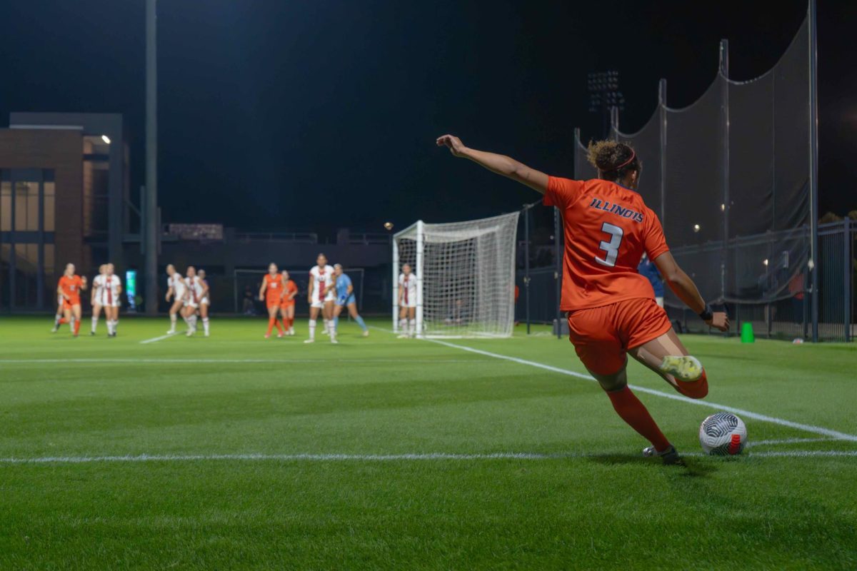 Graduate student Bel Rolley kicks the ball towards the opposing goal during a corner kick in the second half of a match against Wisconsin on Oct. 12, 2023.