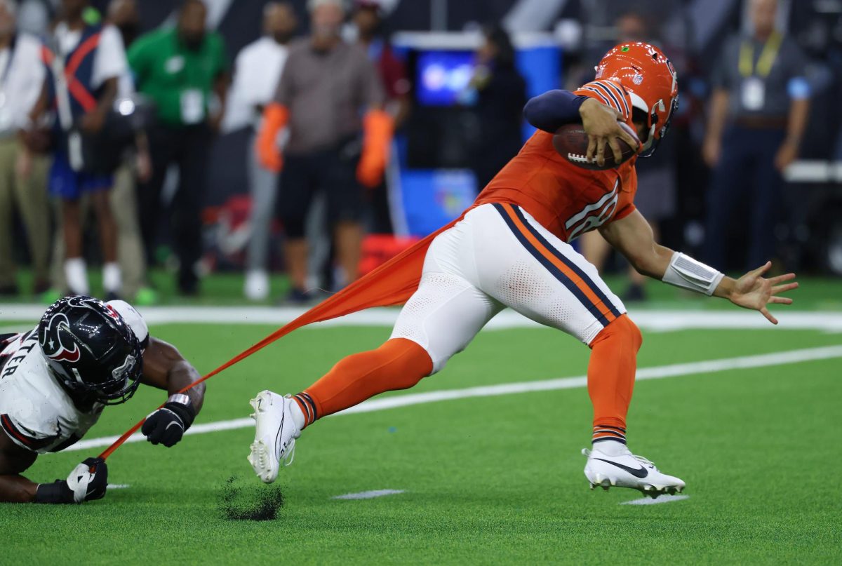 Texans defensive end Danielle Hunter (55) grabs the jersey of Bears quarterback Caleb Williams (18) in the fourth quarter at NRG Stadium on Sept. 15, 2024, in Houston. 