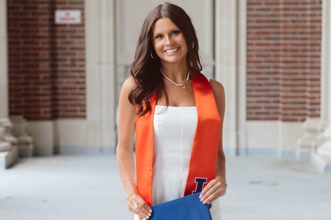 Class of 2024 graduate Gabriella Potocki poses for her senior photos inside the upper levels of Memorial Stadium in Champaign.