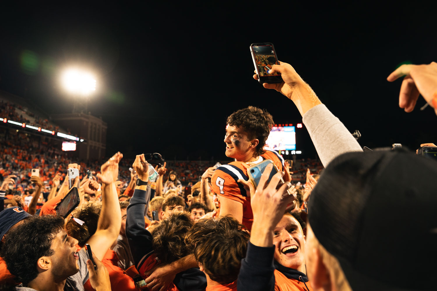 Illini rush the Memorial Stadium Field on Sept. 7, 2024 after upsetting Kanasas 23-17. Seats for the game were all sold out, in-which the last occurance of a fully booked game at Memorial Stadium was in 2016.