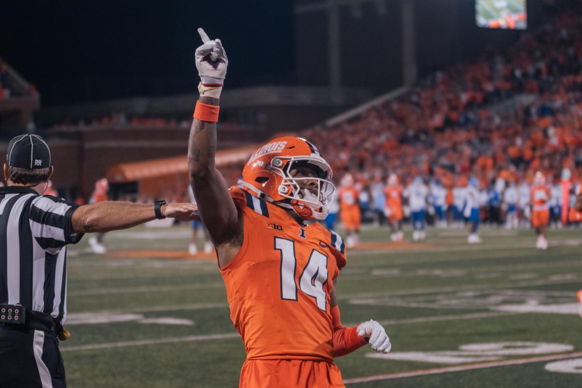 Junior defensive back Xavier Scott wags his finger after denying a Kansas pass during Illinois big win on Saturday.