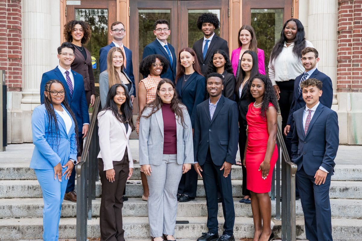 The 2024 Homecoming court poses for a picture on the steps of Foellinger Auditorium on the Main Quad.