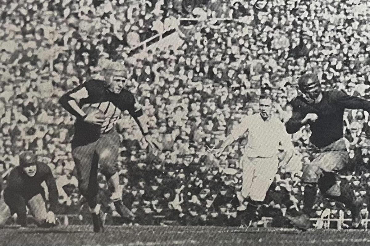 Red Grange runs with ball in-hand as Illinois takes on Michigan during the 1924 season.