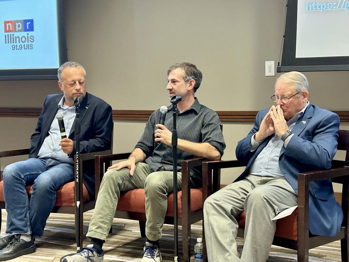 Professors Konstantin Sonin (left), Nicholas Grossman (center) and Dick Farkas (right) discuss the future of foreign policy at an NPR Illinois event on Wednesday. 