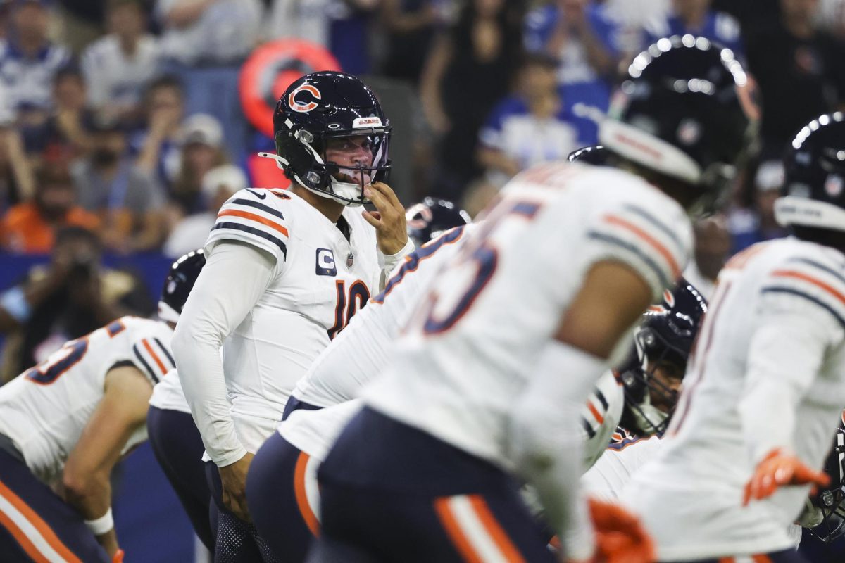 Chicago Bears quarterback Caleb Williams looks at his teammates before a snap during the first quarter against the Indianpolis Colts on Sept. 22, 2024, at Lucas Oil Stadium in Indianapolis.