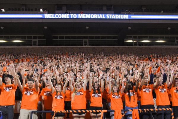 New students practice cheers along with the Marching Illini at Sights and Sounds on Aug. 22 in Memorial Stadium.