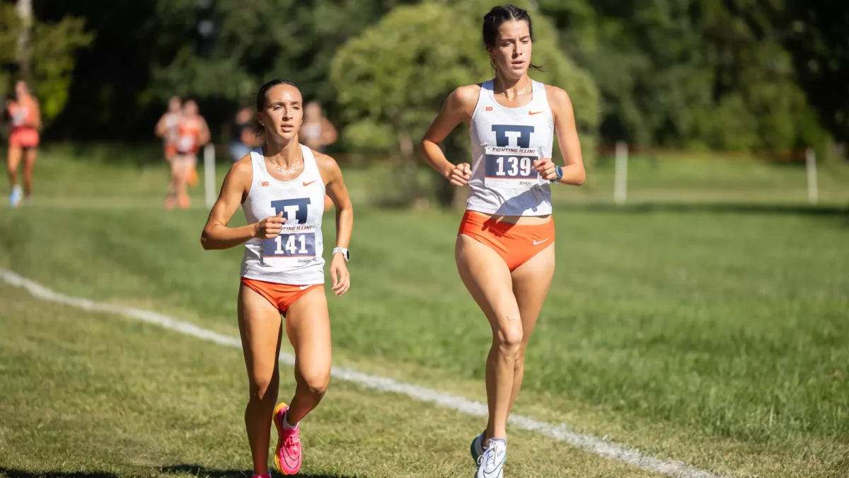 Junior Halle Hill and Junior Maggie Gamboa run alongside each other during the Illinois v Wisconsin cross country meet, 2023.
