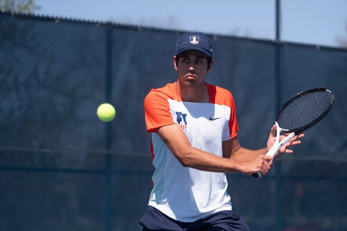 Redshirt Freshman Zach Vilala hits while  at Atkins Tennis Center in Champaign.