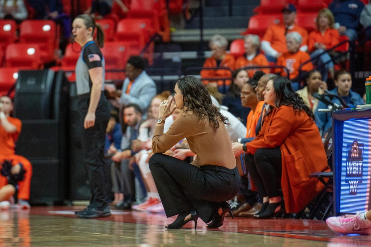 Women’s basketball head coach Shauna Green kneels down on the court to watch her players try and make a stop against Missouri State in a tough matchup on March 21. 