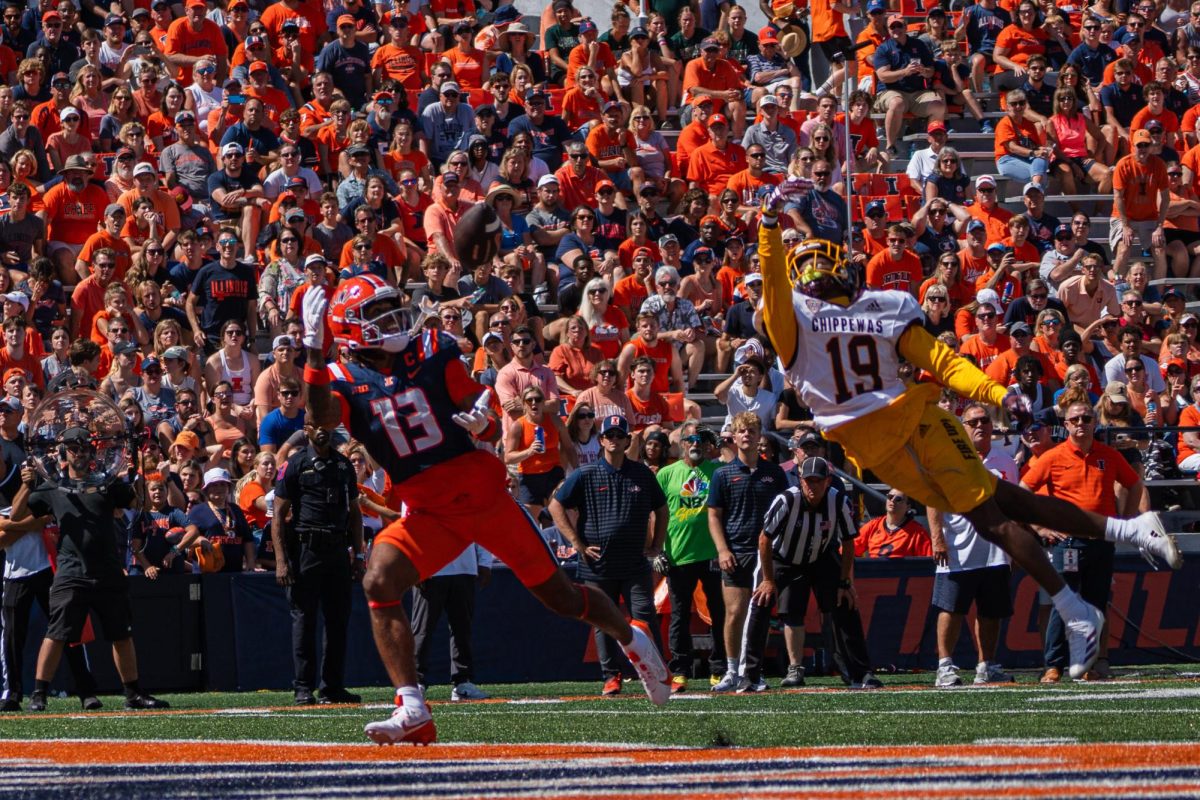 Wide receiver Pat Bryant looks to the sky as a Central Michigan defender leaps after him during the homecoming game on September 14.