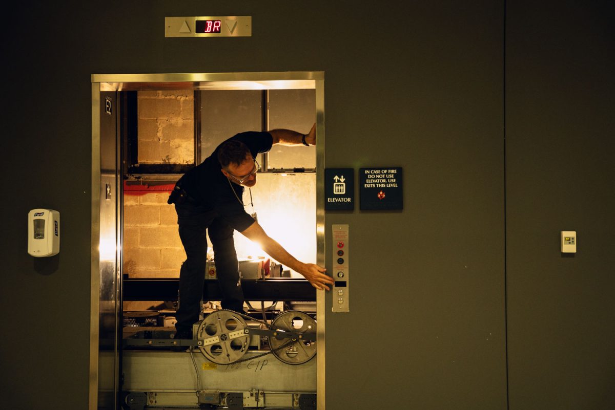 Elevator maintenance occurs after an electrical fire ignites within an elevator inside the Chemistry Annex located on S Matthews Ave on Friday night.