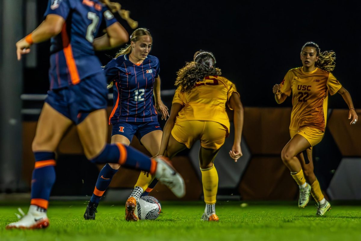 Sophomore defender Mya Archibald makes a strong effort to push the ball upfield, but must first navigate past a USC opponent standing in her way.