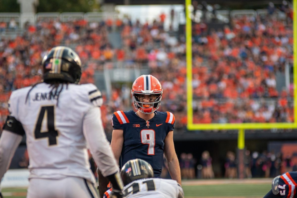 Illinois quarterback Luke Altmyer checks Purdue's coverage during Illinois' win over them on Oct. 12 in Champaign.