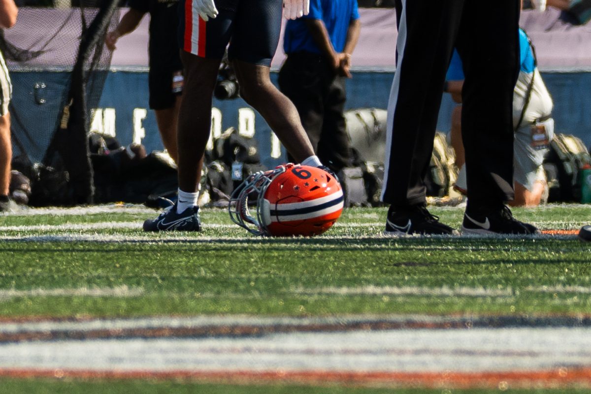 Outside linebacker Seth Coleman's helmet lays on the field after taking a big hit during the Illinois v Purdue football game on Oct. 12. in Memorial Stadium