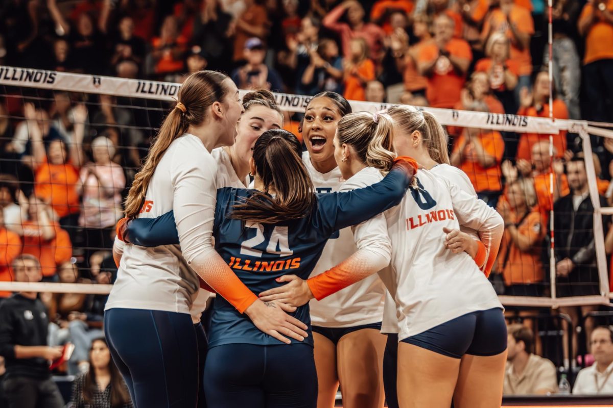 Illinois celebrates after clinching a heated point in the first set against Maryland on Oct. 20. 